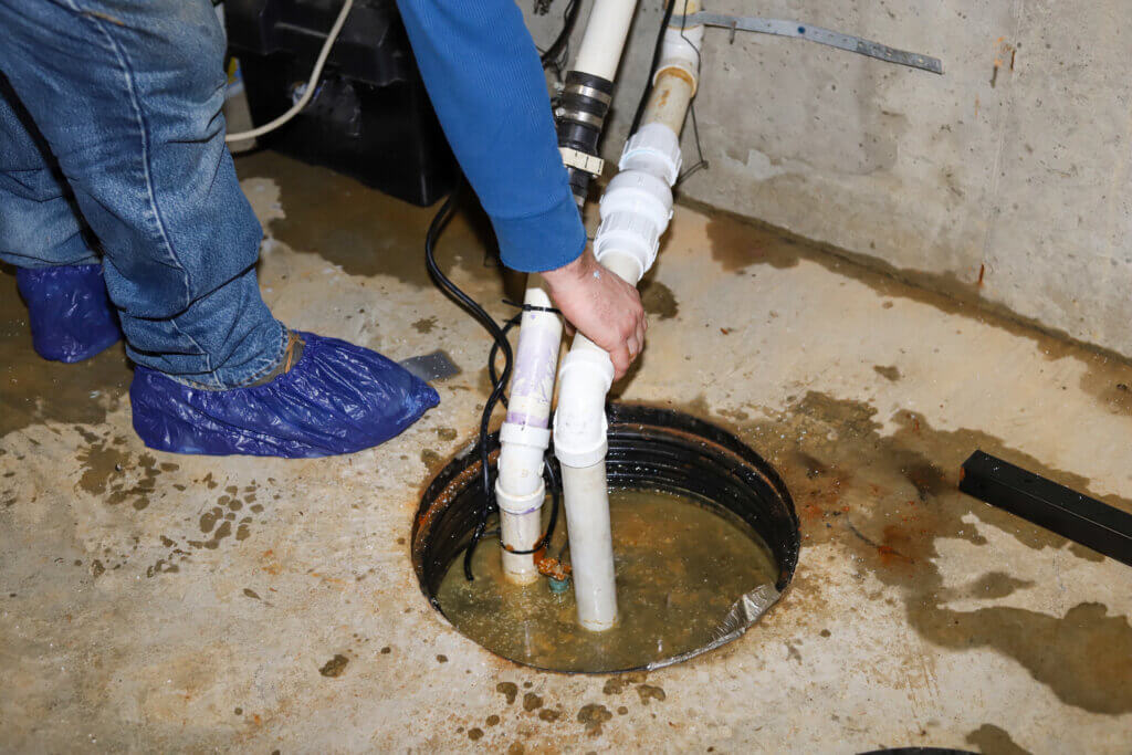 Plumbers 911 | Plumbing Contractor Referral Service | plumber Repairing Sump Pump | Sump Pump Installation, Repair, Maintenance