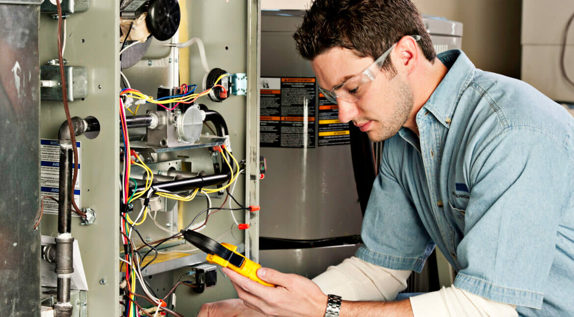 HVAC Service technician testing a furnace | Plumbers 911 | Contractor Referral Service